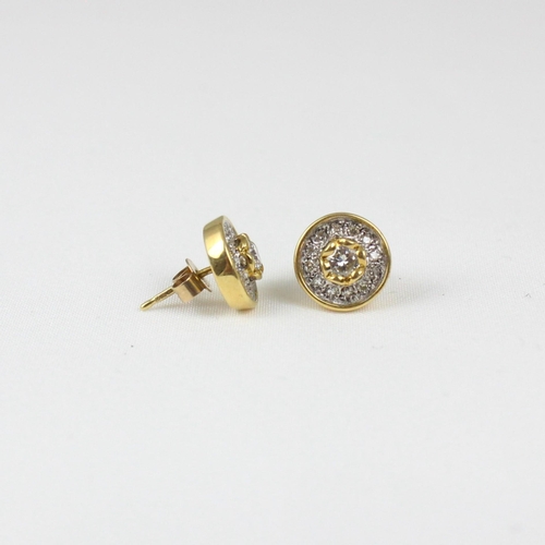 384 - A pair of 18ct yellow gold diamond cluster earrings, the round cut diamond within surround of twelve... 