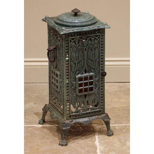 770 - A late 19th century green enamelled cast iron cathedral heater cabinet, of openwork foliate design, ... 