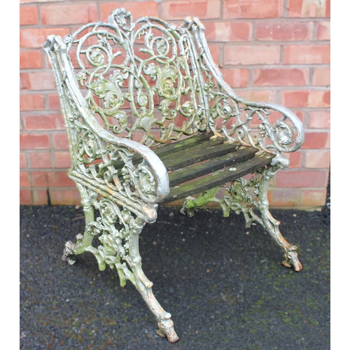 1011 - A Coalbrookdale type cast iron garden chair, 19th century, cast as naturalistic branches and scrolli... 