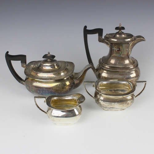 106 - A George V silver tea service, Walker and Hall, Sheffield 1934, comprising a hot water jug, teapot, ... 