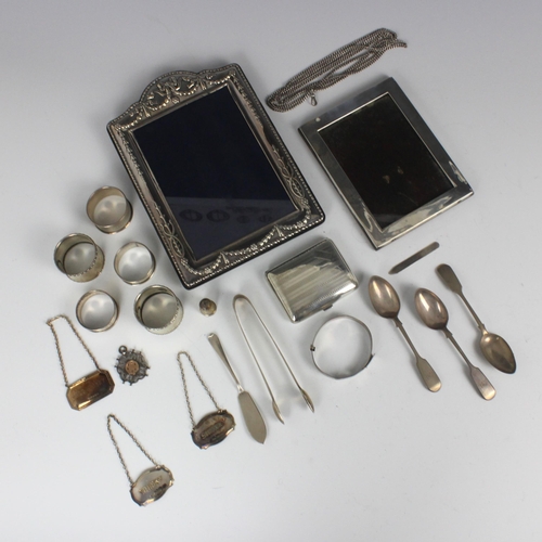 11 - A selection of silver and white metal pieces, including a set of three Victorian silver fiddle patte... 