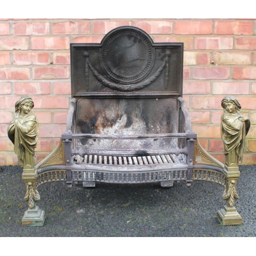 767 - An Adam style cast iron and brass fire grate, late 19th/early 20th century, the break arch fire back... 