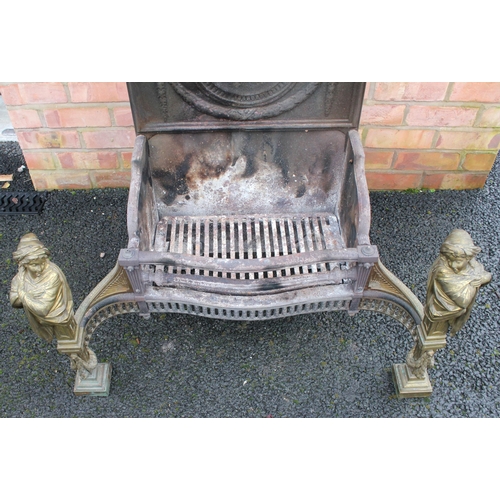 767 - An Adam style cast iron and brass fire grate, late 19th/early 20th century, the break arch fire back... 