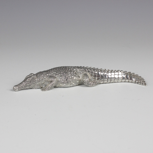 82 - A Patrick Mavros silver model of a crocodile, with realistic detail throughout, stamped with import ... 