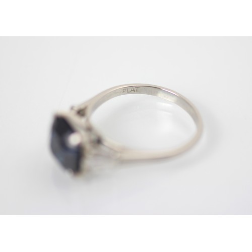 177 - An Art Deco style diamond and untested sapphire ring, the central emerald cut untested sapphire claw... 
