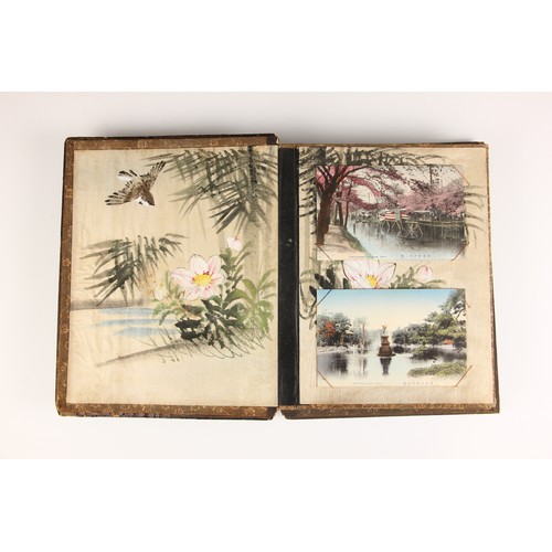 400 - A Chinoiserie lacquered album containing a collection of postcards from the first quarter of the 20t... 