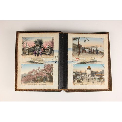 400 - A Chinoiserie lacquered album containing a collection of postcards from the first quarter of the 20t... 