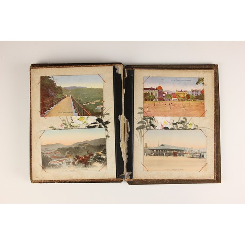 400 - A Chinoiserie lacquered album containing a collection of postcards from the first quarter of the 20t... 