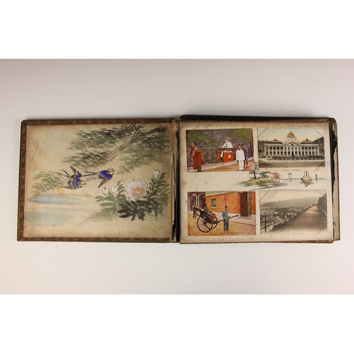 400 - A Chinoiserie lacquered album containing a collection of postcards from the first quarter of the 20t... 