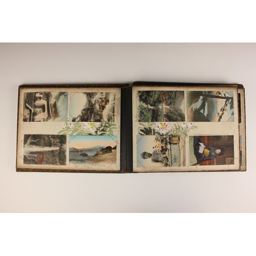 400 - A Chinoiserie lacquered album containing a collection of postcards from the first quarter of the 20t... 