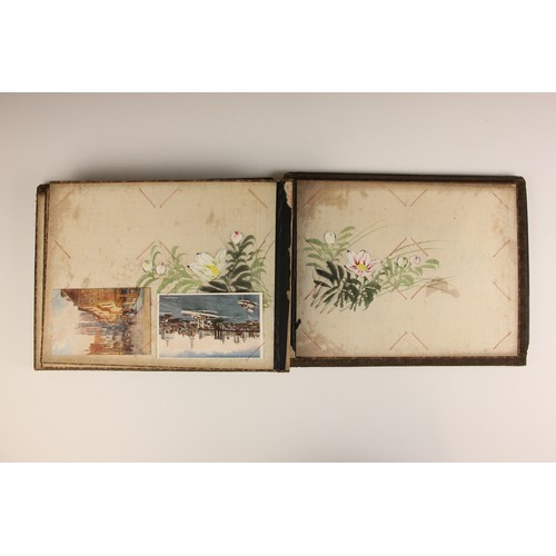 400 - A Chinoiserie lacquered album containing a collection of postcards from the first quarter of the 20t... 