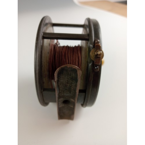 522 - A Hardys 'Patent Perfect' fly fishing reel 10cm diameter with 'rod in Hand' trade mark, ivory handle... 