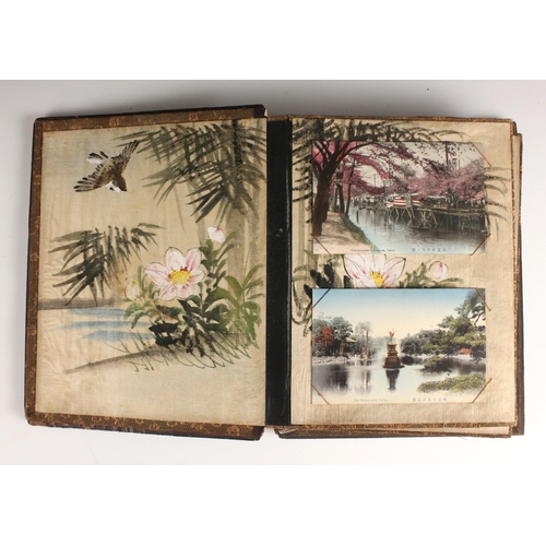 400 - A Chinoiserie lacquered album containing a collection of postcards from the first quarter of the 20t... 