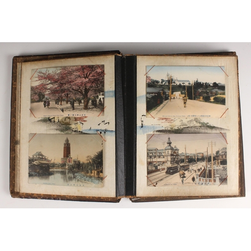 400 - A Chinoiserie lacquered album containing a collection of postcards from the first quarter of the 20t... 