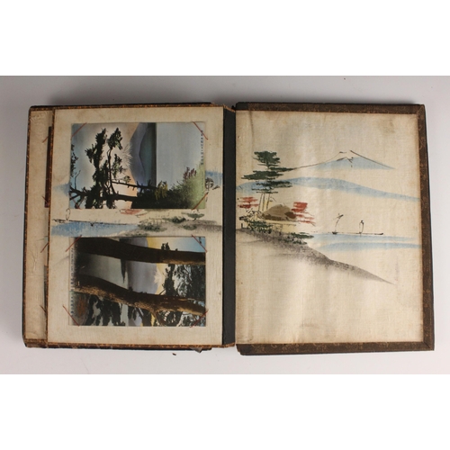 400 - A Chinoiserie lacquered album containing a collection of postcards from the first quarter of the 20t... 