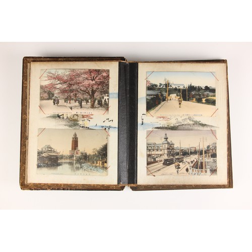 400 - A Chinoiserie lacquered album containing a collection of postcards from the first quarter of the 20t... 