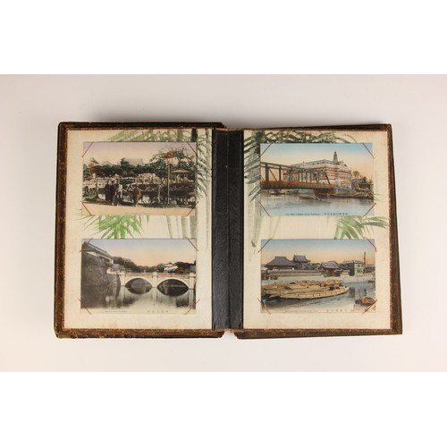 400 - A Chinoiserie lacquered album containing a collection of postcards from the first quarter of the 20t... 