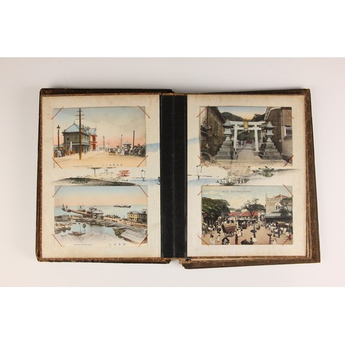 400 - A Chinoiserie lacquered album containing a collection of postcards from the first quarter of the 20t... 