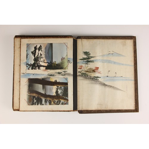 400 - A Chinoiserie lacquered album containing a collection of postcards from the first quarter of the 20t... 