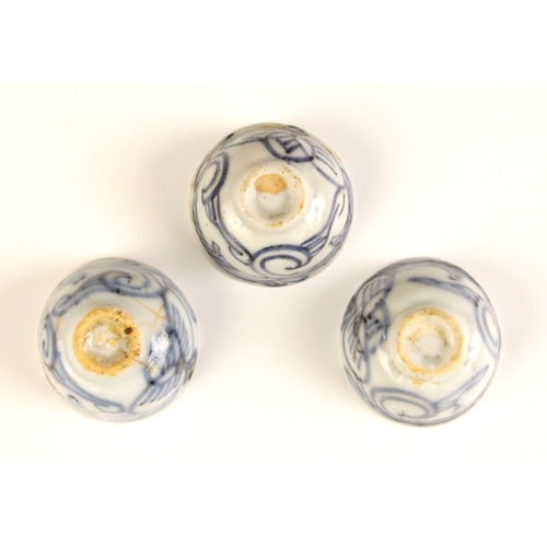 728 - Three Chinese Swatow porcelain blue and white tea bowls, 18th century, each of circular form and dec... 