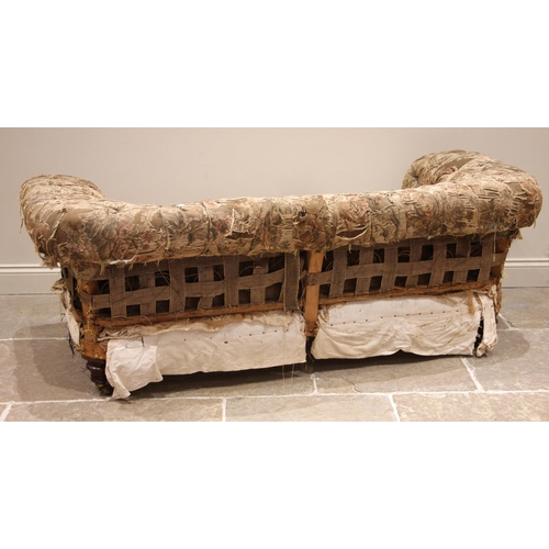 904 - A late 19th century Chesterfield sofa, possibly Howard & Sons, the button down scroll back over a sp... 