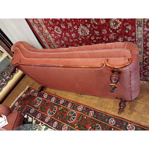 911 - A Victorian day bed, in pink mohair button down fabric, the scroll end extending to a straight front... 