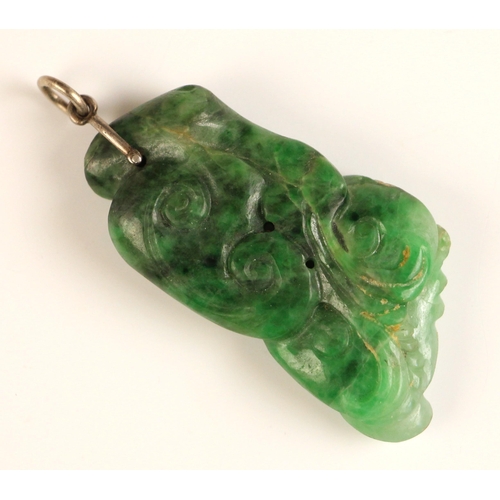 722 - A Chinese carved 'Lingzhi' spinach jade pendant, 19th century, carved as a gourd with scrolling vine... 