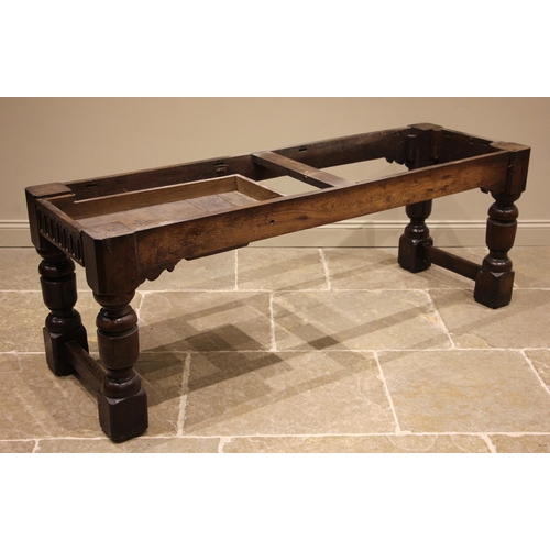 863 - A 17th century style oak refectory/serving table, the three plank top over a nulled frieze to two si... 