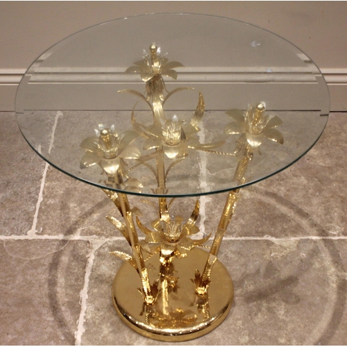 1002 - A Hollywood Regency gilt metal occasional table, late 20th century, the circular bevelled glass tabl... 