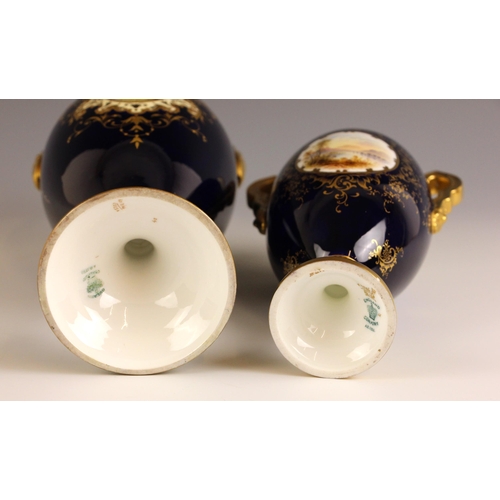 603 - A Coalport porcelain twin handled vase and cover, 20th century, of footed ovoid form, the body paint... 