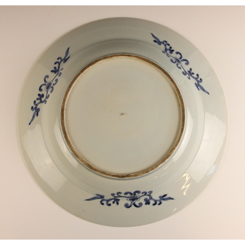 690 - A large Chinese porcelain blue and white charger, of circular form the centre decorated with a lands... 