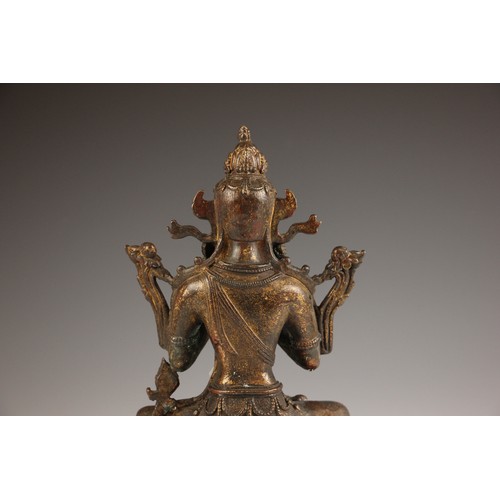 702 - A South East Asian gilt bronze Bodhisattva, seated in dhyanasana on a double lotus base and both han... 