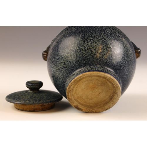 708 - A Chinese Jun ware jar and cover, of bulbous form and mounted with two ox mask lug handles, the cove... 