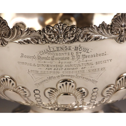 110 - A large Victorian silver presentation bowl, James Deakin & Sons, London 1896, the stylised shell cap... 