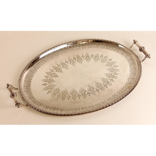 127 - An early 20th century silver plated tray, the foliate cast rectangular rim above florally engraved w... 