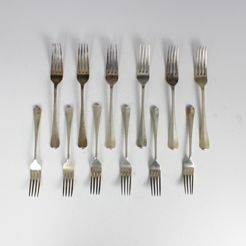 116 - A group of four silver Hanoverian pattern table forks, 'MDQ' Sheffield 1969, of typical form, with t... 