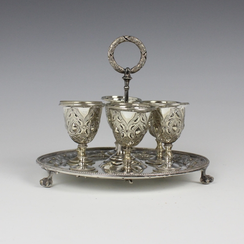 126 - A late 19th century silver plated egg cruet, by Cooke and Kelvey, Calcutta, the circular tray with e... 