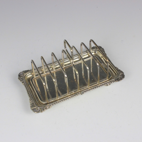 71 - A Victorian silver toast rack, Atkin Brothers, Sheffield 1896, the rectangular shaped thumbpiece abo... 