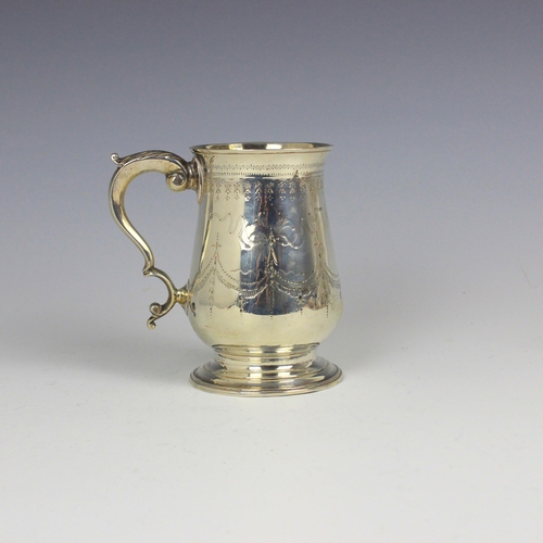 72 - A George III silver mug, Thomas Oliphant/Ollivant, London 1789, the flared rim above baluster body w... 