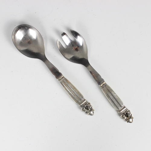 76 - A pair of Georg Jensen white metal salad servers, in the 'Acorn' pattern, stamped 'Georg Jensen Denm... 