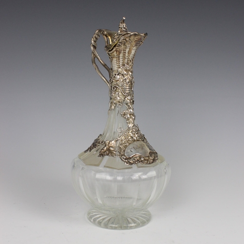 86 - A Victorian silver mounted claret jug, Charles Reily & George Storer, London 1844, the twisted handl... 