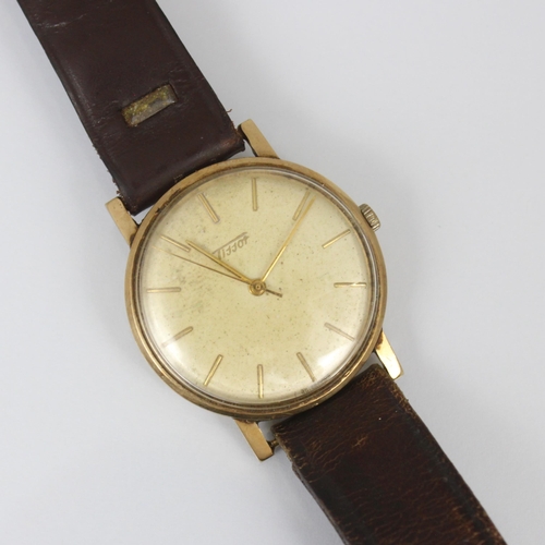 197 - A 9ct cased Tissot wristwatch, the circular cream coloured dial with baton markers, set to plain pol... 