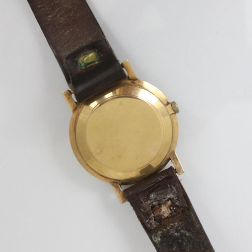 197 - A 9ct cased Tissot wristwatch, the circular cream coloured dial with baton markers, set to plain pol... 