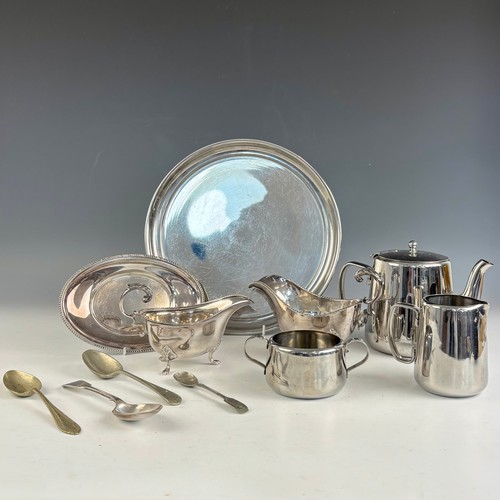 64 - A selection of silver plate, including two silver plate sauce boats, with a stainless steel tea serv... 