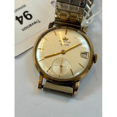 94 - A late 20th century 9ct gold cased 'Marvin Agenda' wristwatch, the circular cream coloured dial with... 