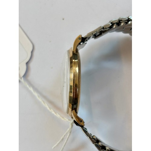 94 - A late 20th century 9ct gold cased 'Marvin Agenda' wristwatch, the circular cream coloured dial with... 