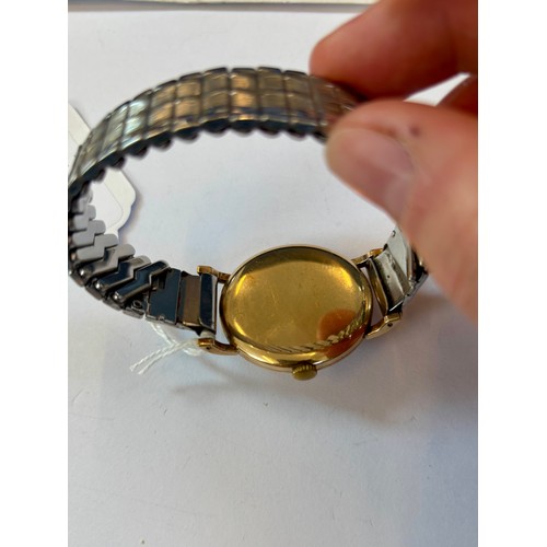 94 - A late 20th century 9ct gold cased 'Marvin Agenda' wristwatch, the circular cream coloured dial with... 