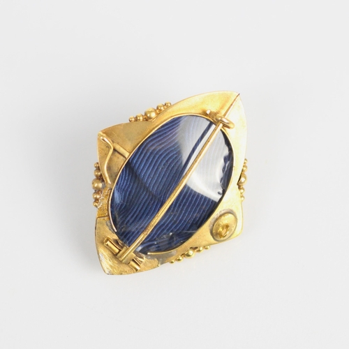 227 - A 19th century gold coloured enamel and split pearl brooch/pendant, the shaped brooch with raised ce... 