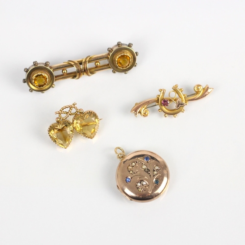 265 - A 19th century citrine brooch, the two heart cut citrines surmounted by a rope twist bow, open to th... 