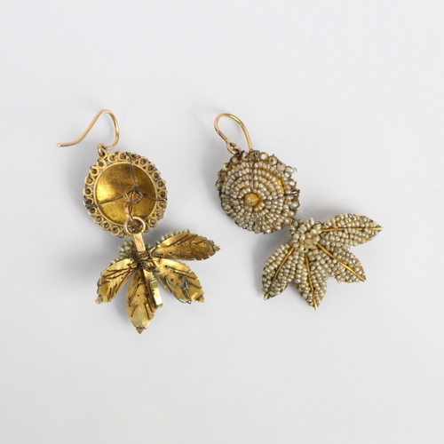 271 - A pair of 18th century seed pearl earrings, the circular bombe seed pearl centre suspending a stylis... 